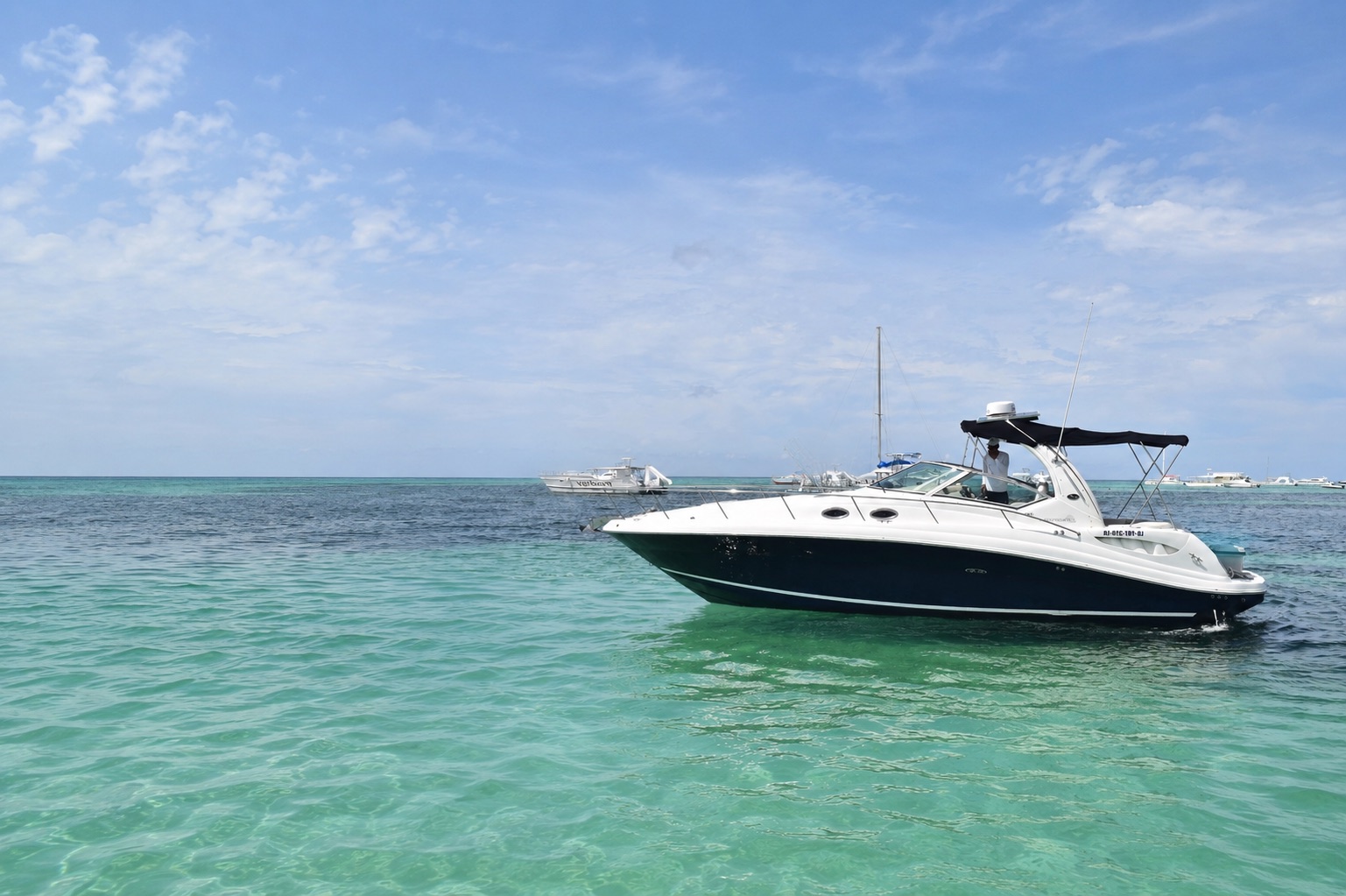 Sharkcana Sea Ray 340 yacht anchored on the turquoise water off Bávaro, Punta Cana